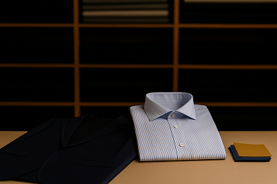 Master tailor working on a custom suit at Myra Tailors